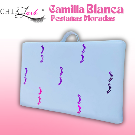 CAMILLA BLANCA PORTATIL CON PESTAÑAS MORADAS